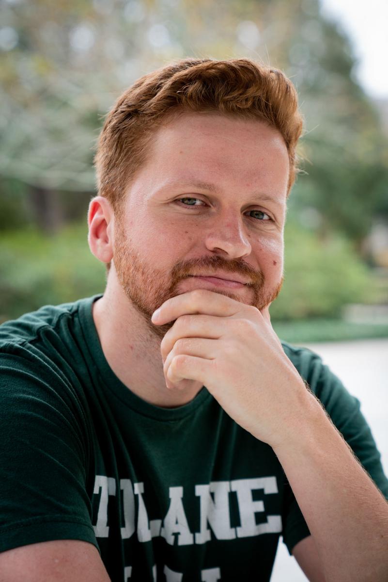 man with red hair with a thinking pose