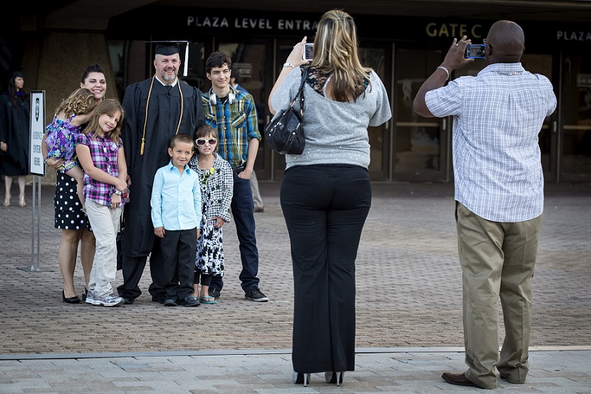 Family taking graduation pictures