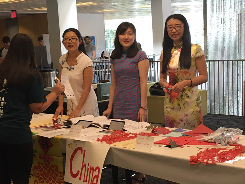 Students working china booth