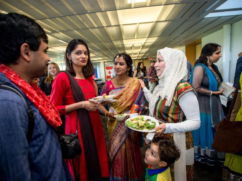 international scholars enjoying food